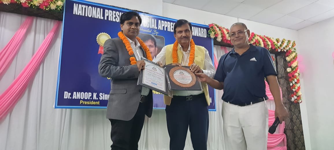  Dr. Ajay Kumar With IMA National President Dr Sahajanand Prasad singh during award ceremony